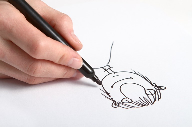 Menschliche Hand skizziert Karikatur